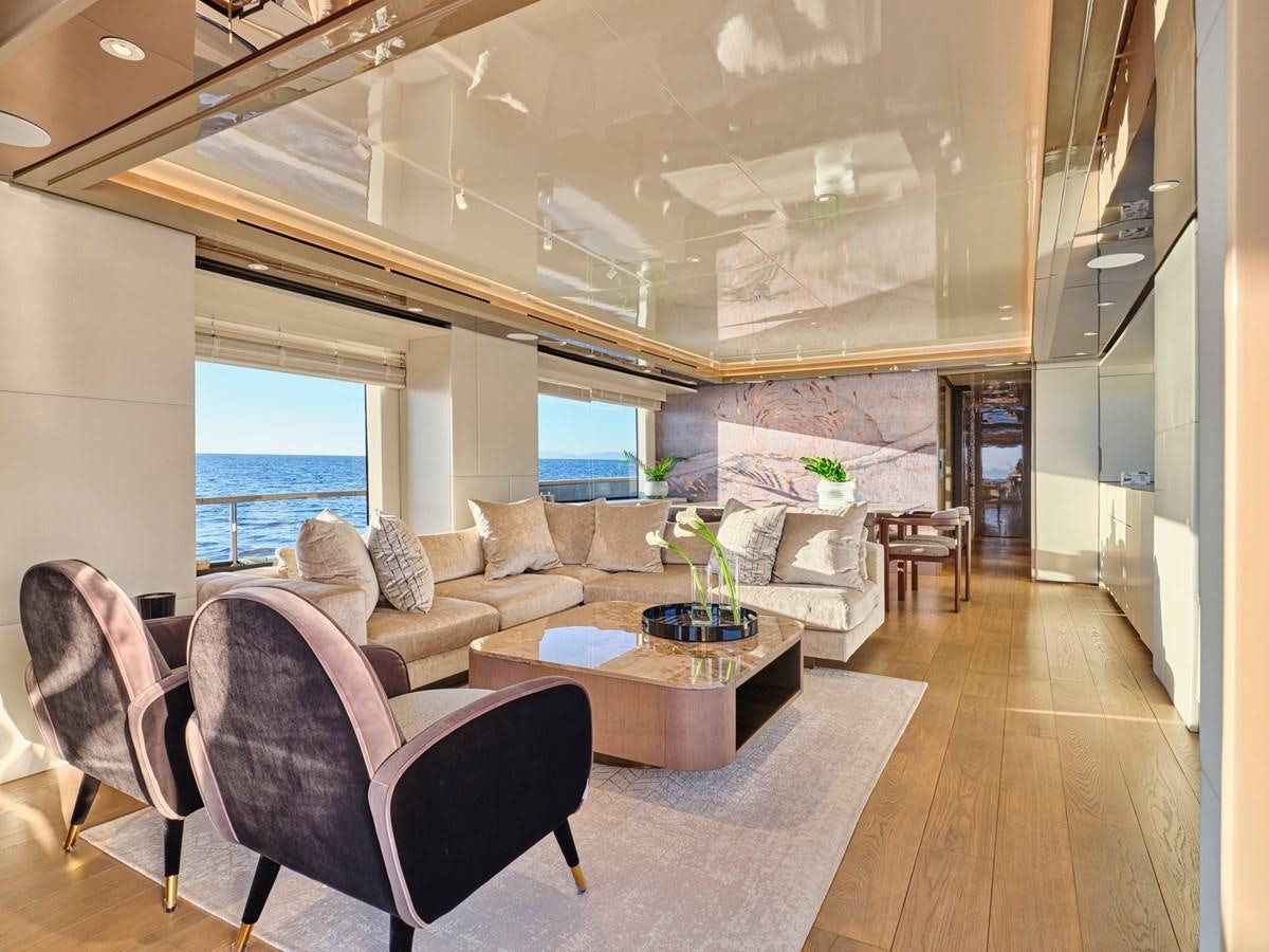 a living room with a large window aboard SEAMMETRY Yacht for Sale