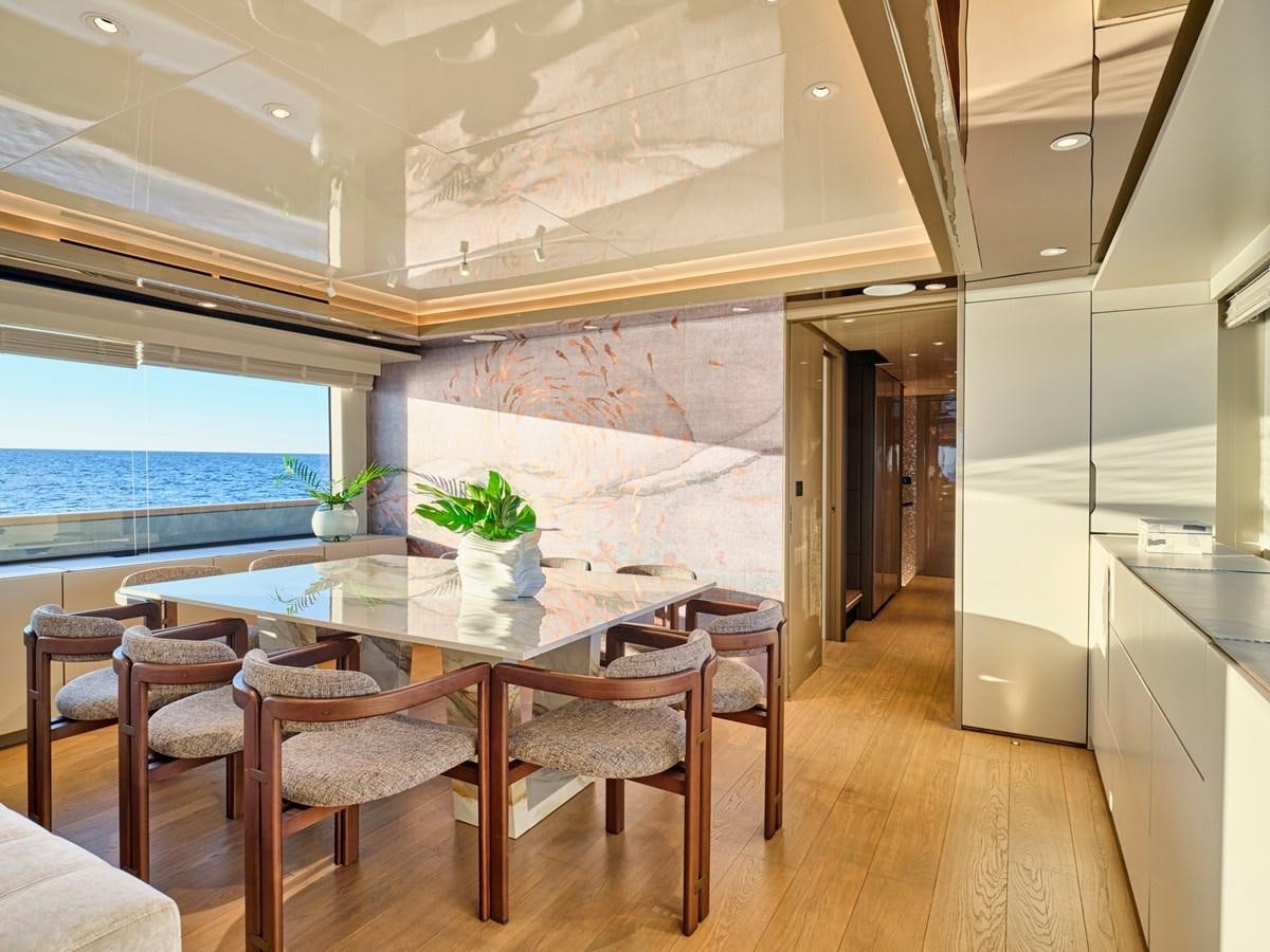 a dining table in a room aboard SEAMMETRY Yacht for Sale
