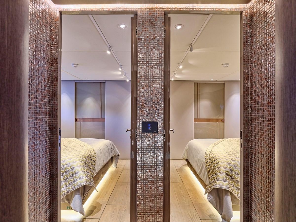 a room with a couple of beds aboard SEAMMETRY Yacht for Sale