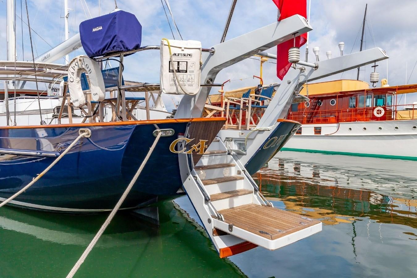 a boat tied to a dock aboard CABOCHON Yacht for Sale