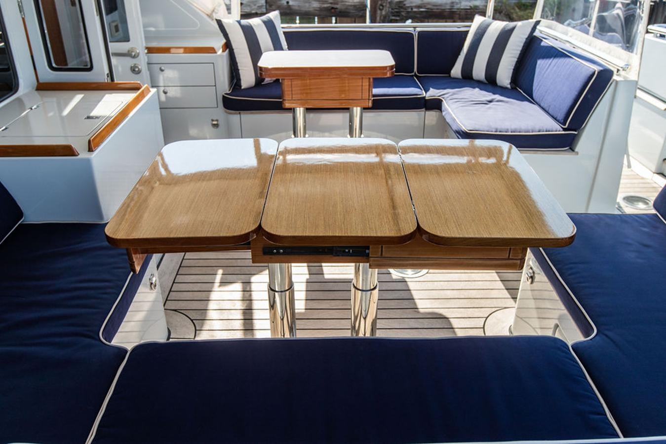 a room with a desk and chairs aboard CABOCHON Yacht for Sale