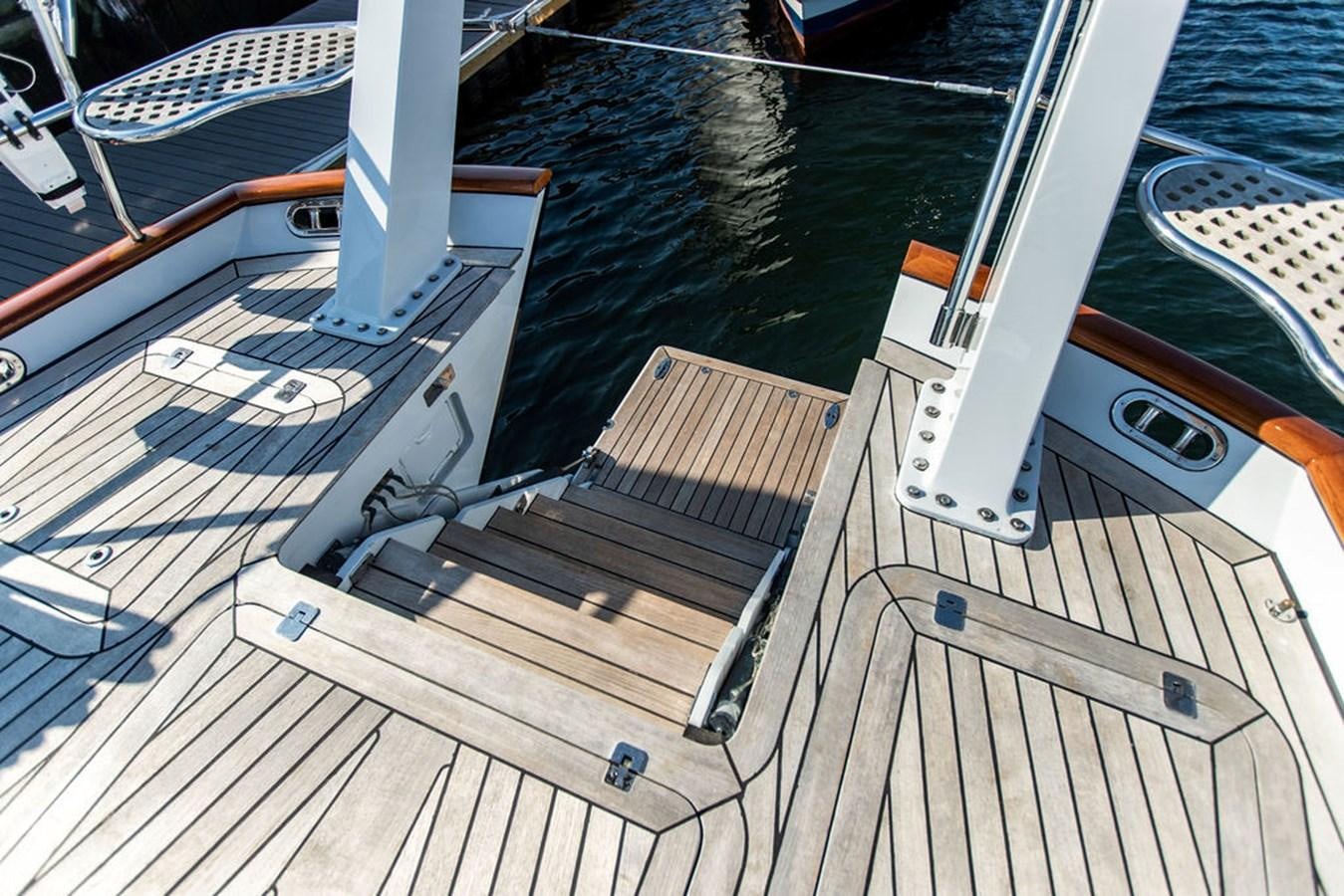 a deck with a boat on it aboard CABOCHON Yacht for Sale