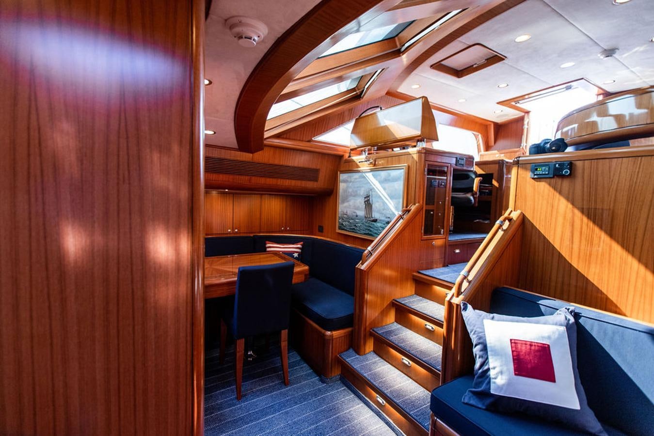 a cabin with a bed and a chair aboard CABOCHON Yacht for Sale