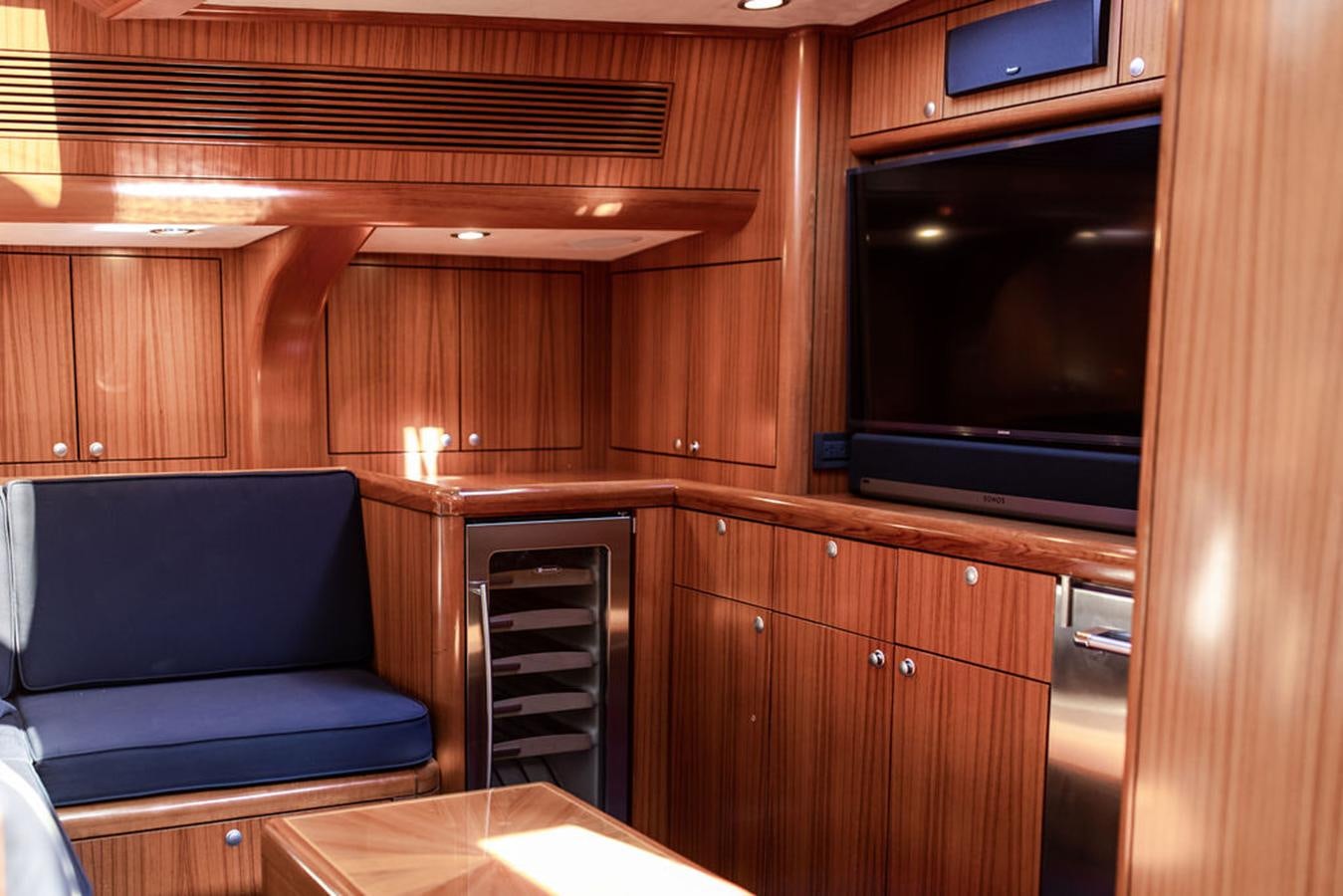 a room with a couch and a tv aboard CABOCHON Yacht for Sale