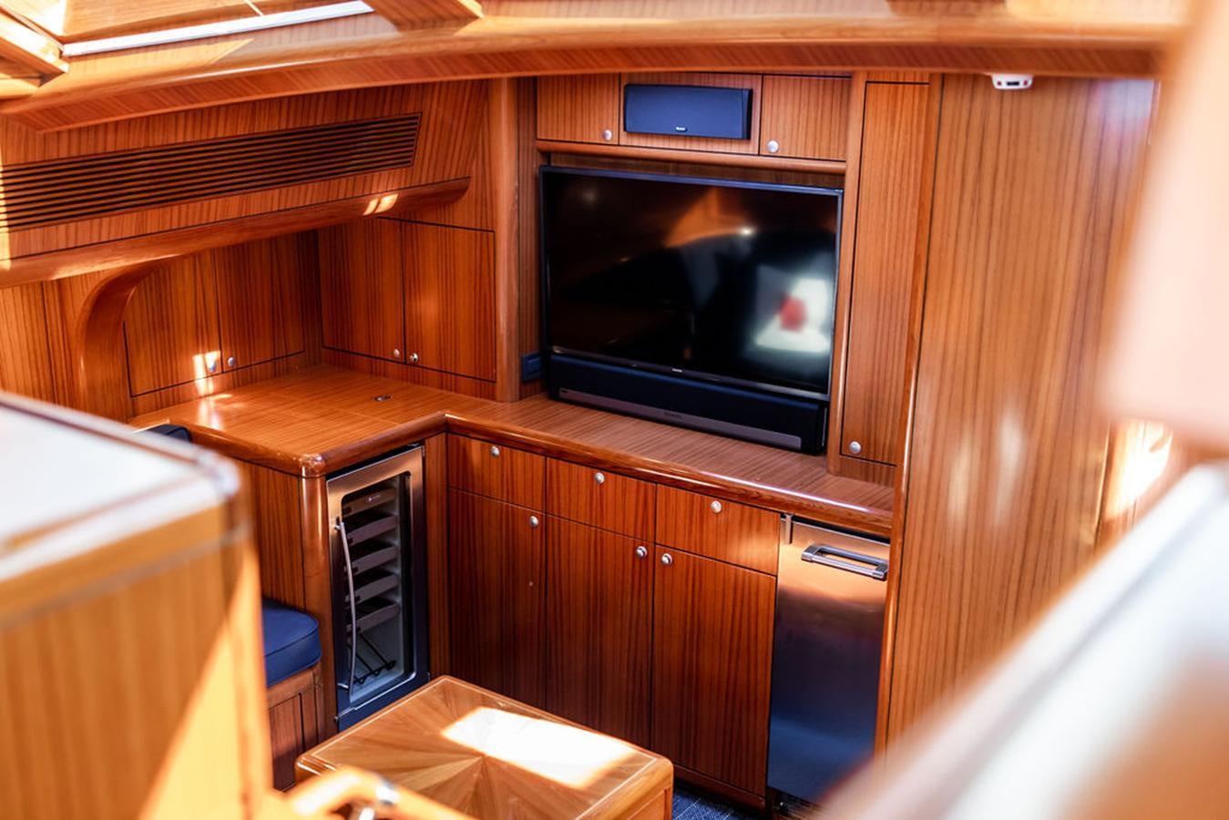 a microwave oven in a wooden cabinet aboard CABOCHON Yacht for Sale