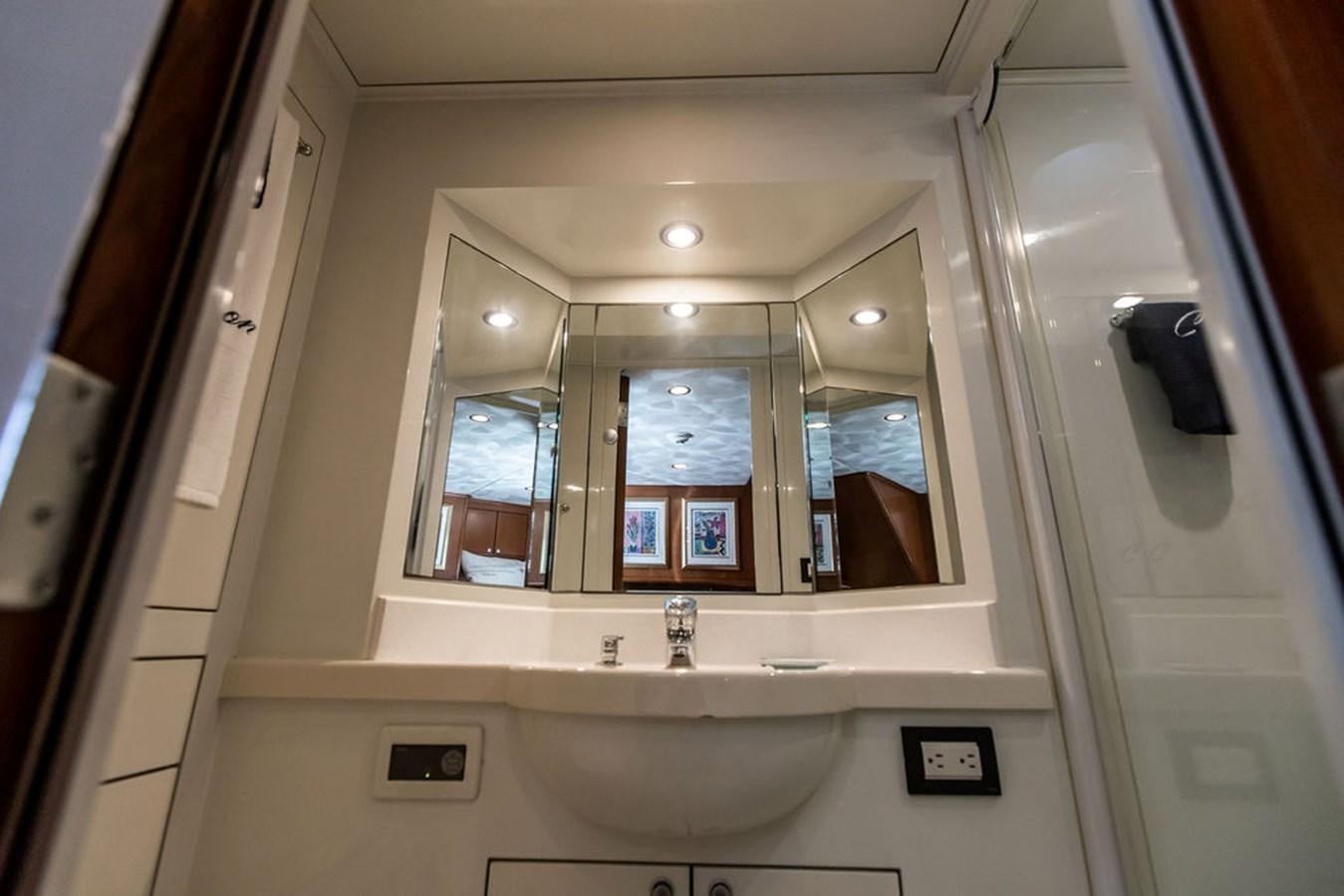 a bathroom with a large mirror aboard CABOCHON Yacht for Sale