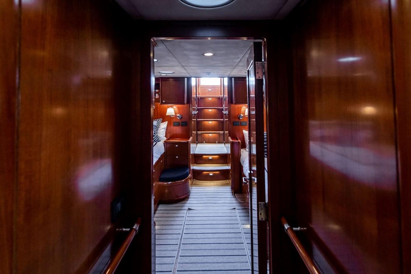 a hallway with wooden doors aboard CABOCHON Yacht for Sale