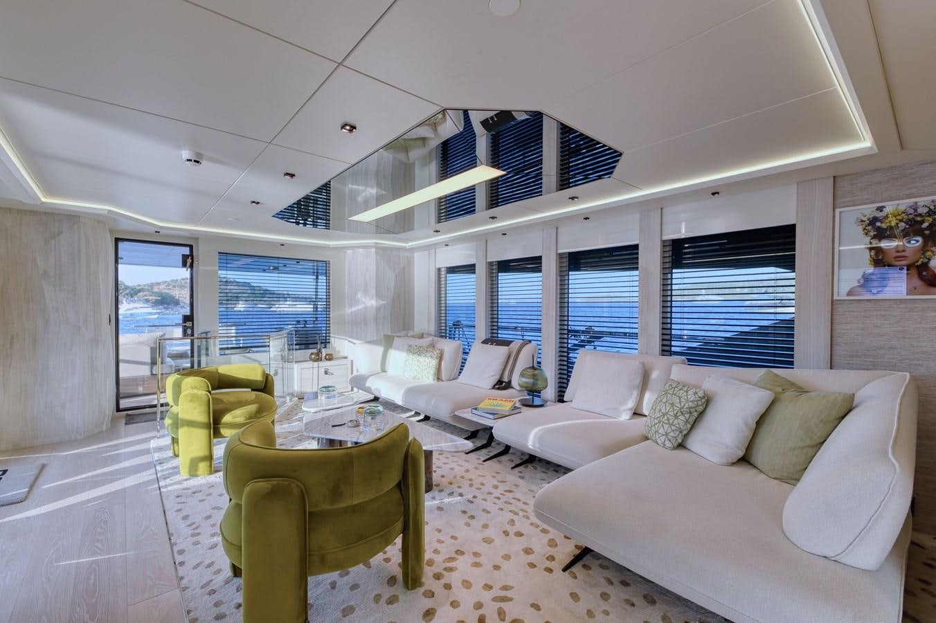 a living room with a large window aboard ROCK X Yacht for Sale