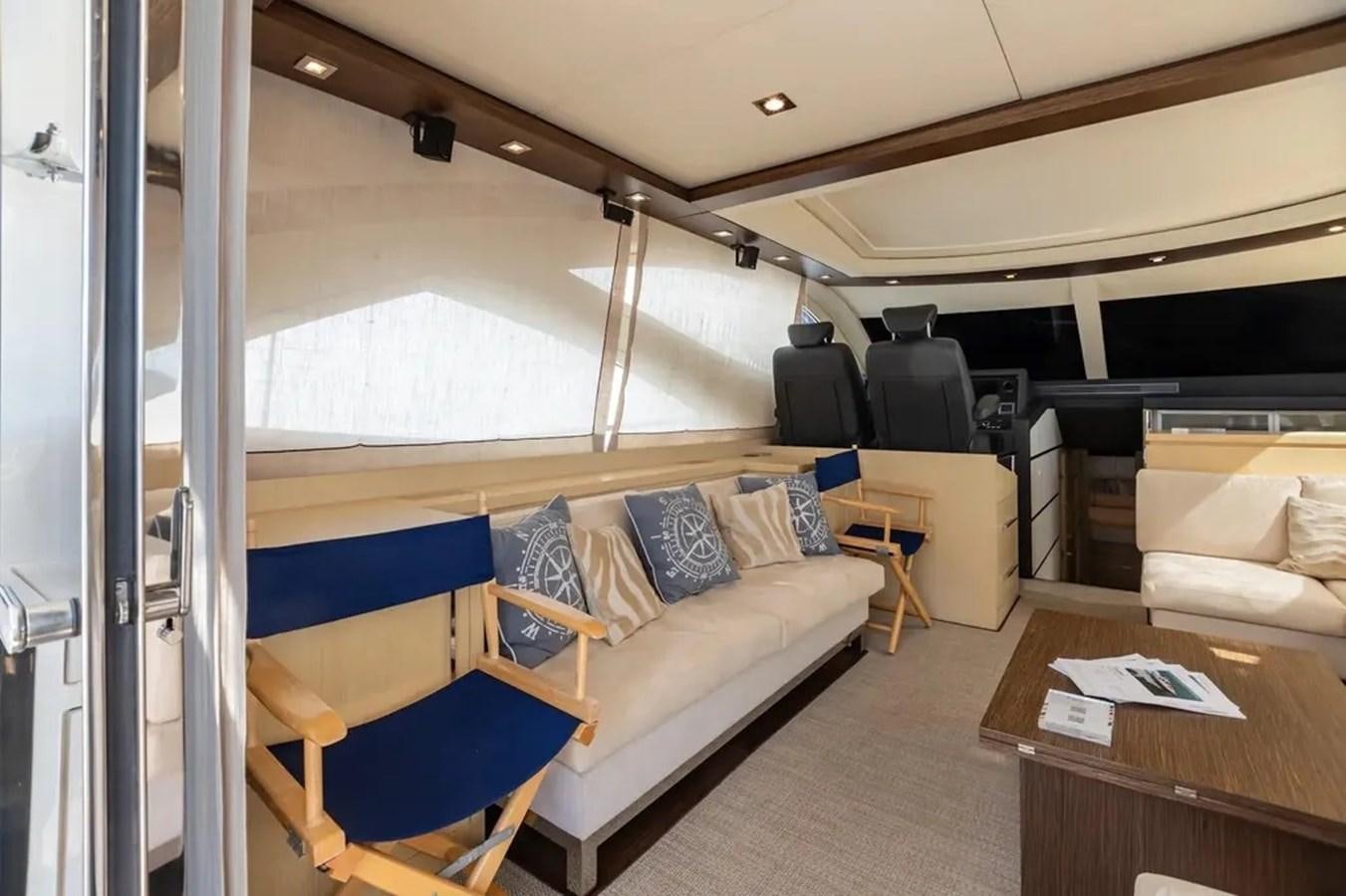 a room with a couch and a table aboard BELLA VITA Yacht for Sale