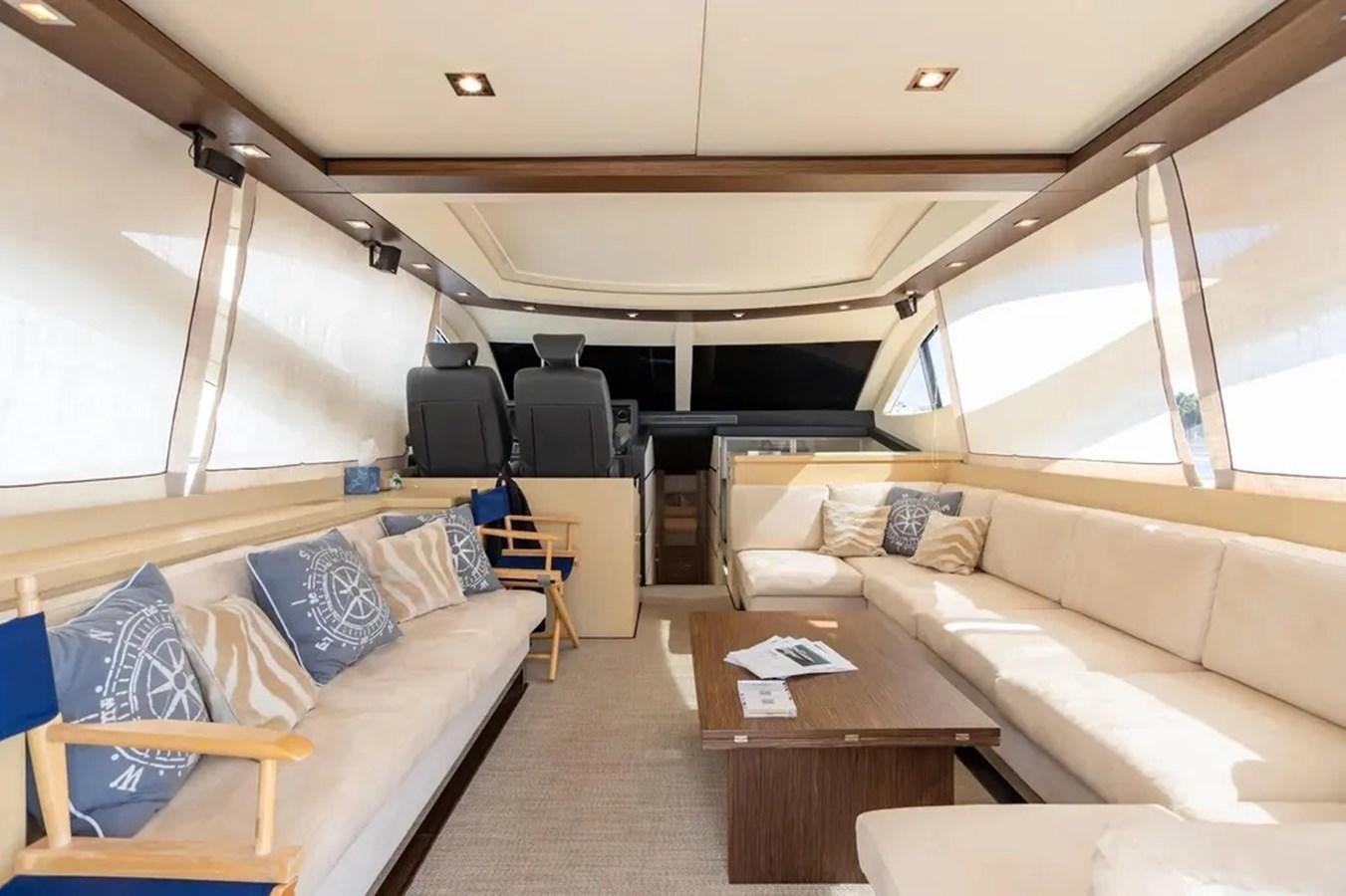 a room with a couch and a table aboard BELLA VITA Yacht for Sale