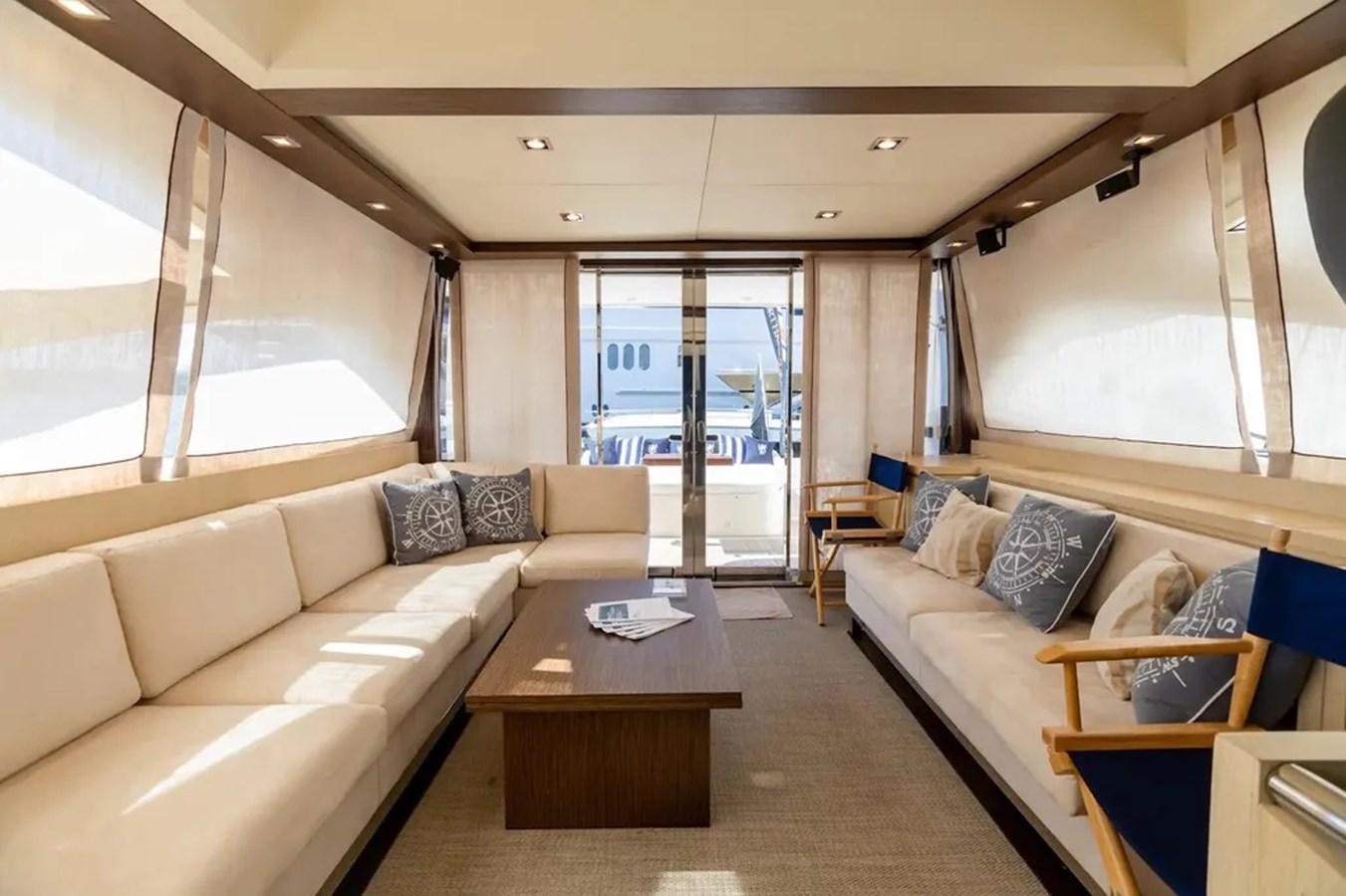 a living room with a couch and a table aboard BELLA VITA Yacht for Sale
