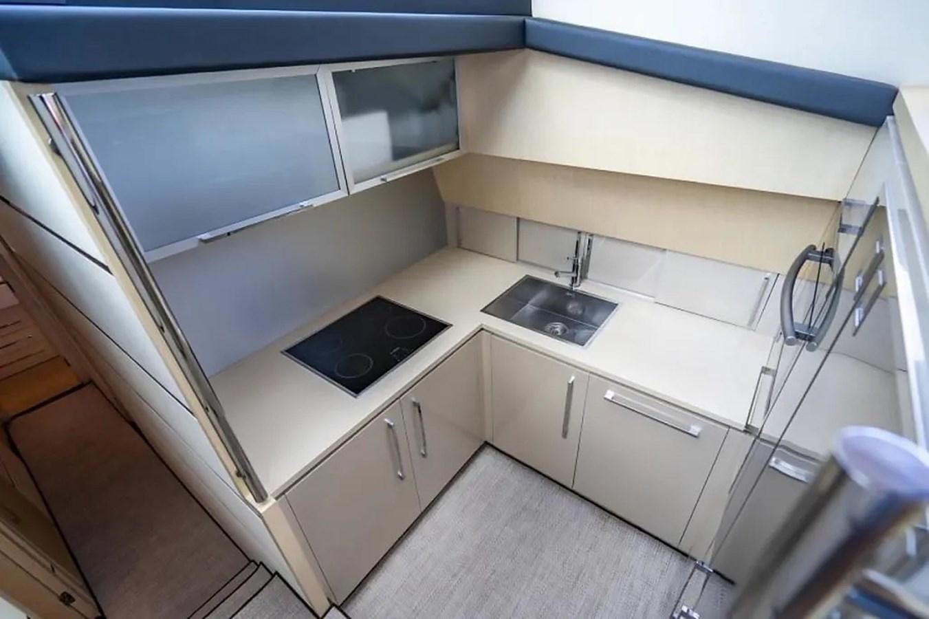 a kitchen with a sink and cabinets aboard BELLA VITA Yacht for Sale