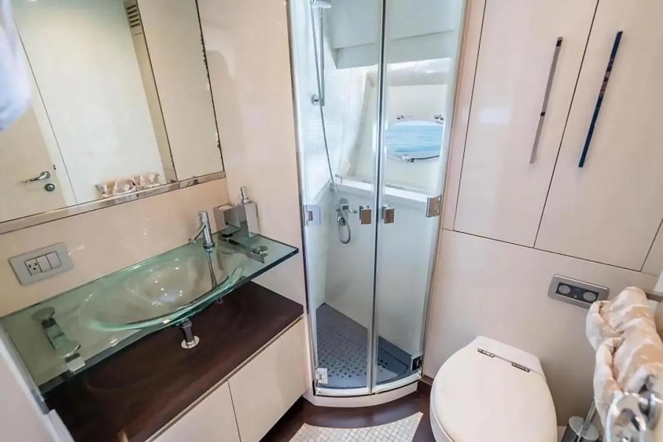 a bathroom with a glass shower aboard BELLA VITA Yacht for Sale