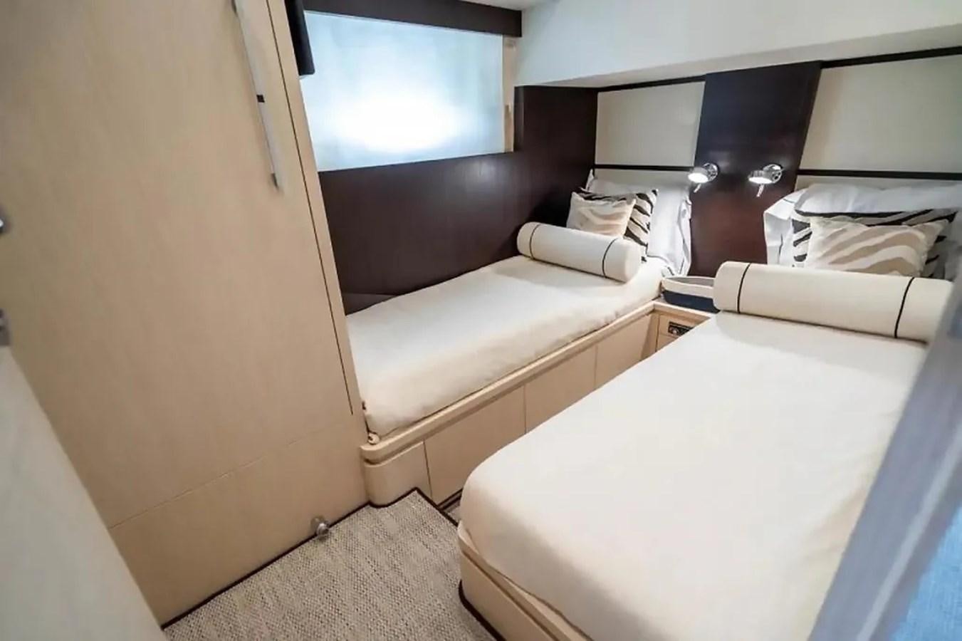 a room with a bed and a window aboard BELLA VITA Yacht for Sale