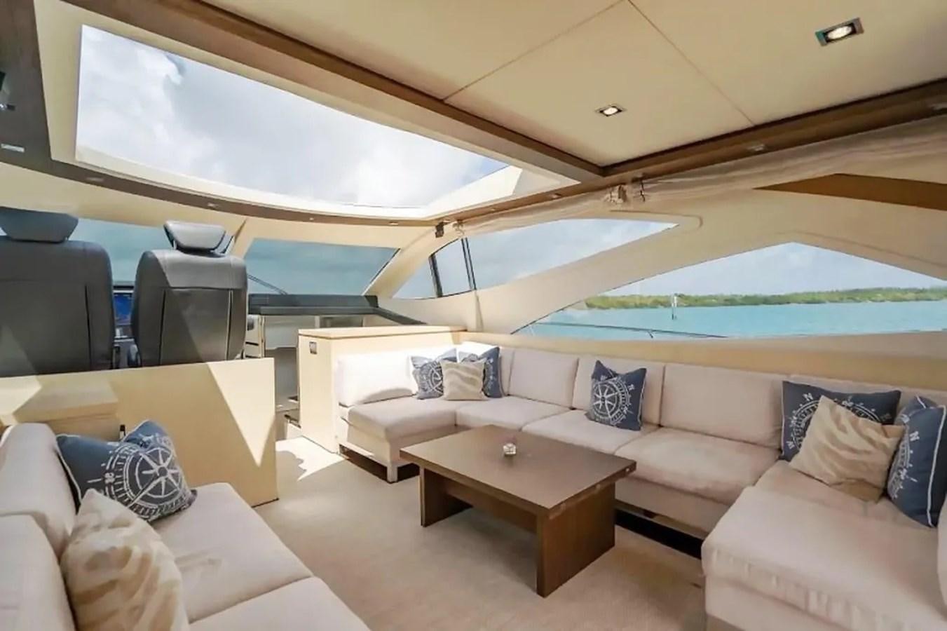 a room with a couch and a table aboard BELLA VITA Yacht for Sale