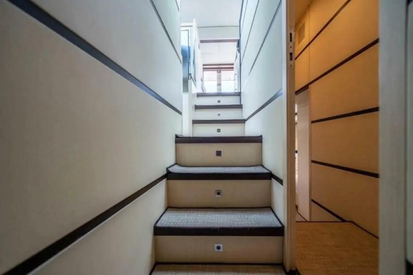 a set of stairs in a house aboard BELLA VITA Yacht for Sale