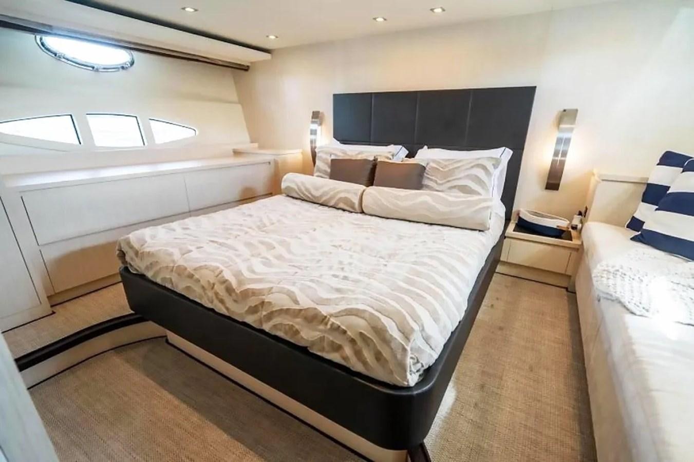 a room with a bed and a television aboard BELLA VITA Yacht for Sale