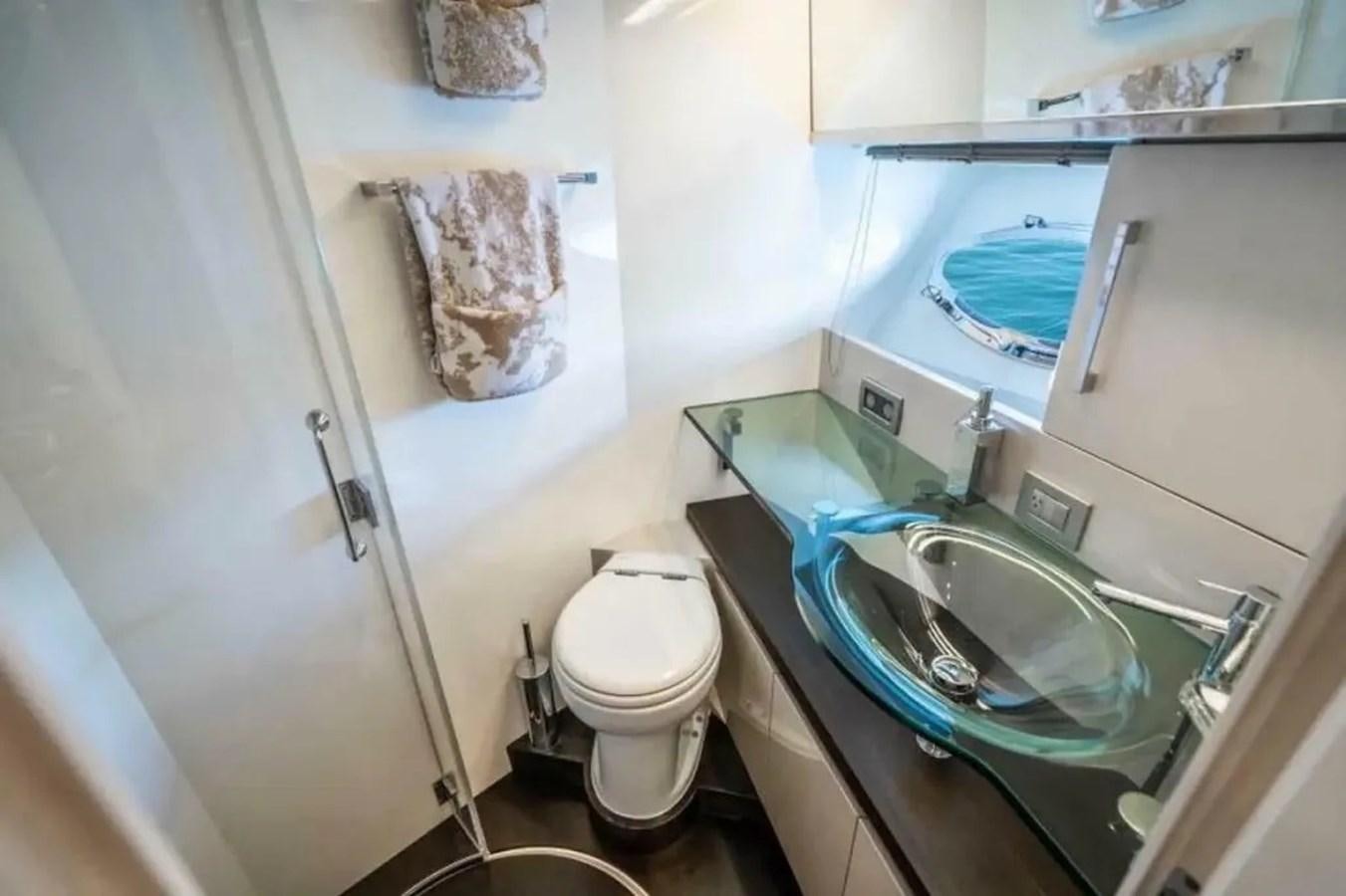 a bathroom with a sink and toilet aboard BELLA VITA Yacht for Sale