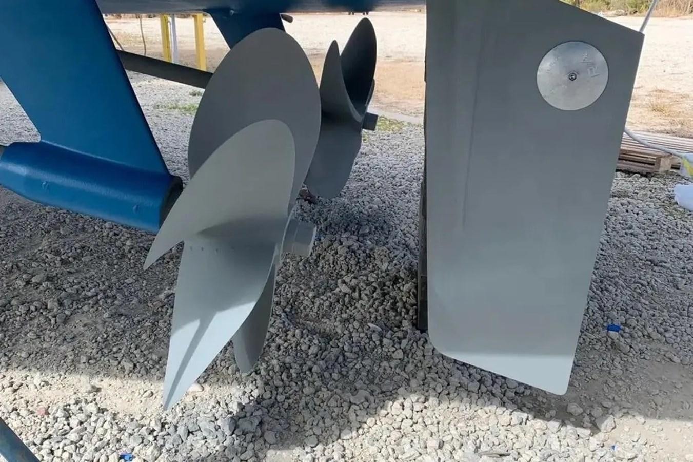 a group of chairs on a concrete surface aboard BELLA VITA Yacht for Sale