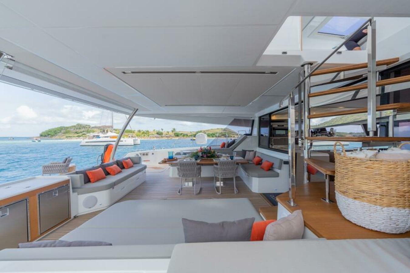 a living room with a large pool aboard 2022 FOUNTAINE PAJOT POWER 67 Yacht for Sale