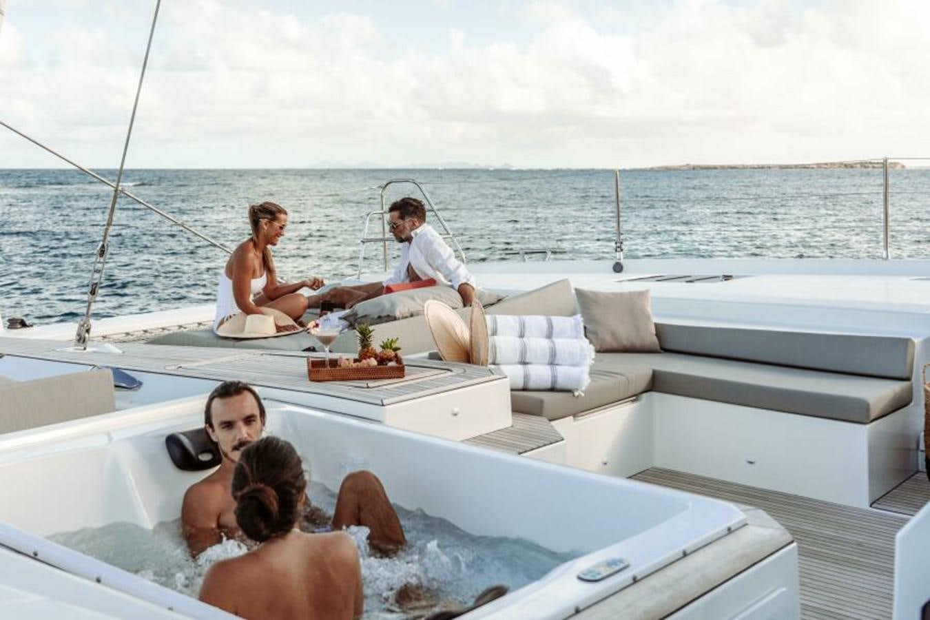 a group of people on a boat aboard 2022 FOUNTAINE PAJOT POWER 67 Yacht for Sale