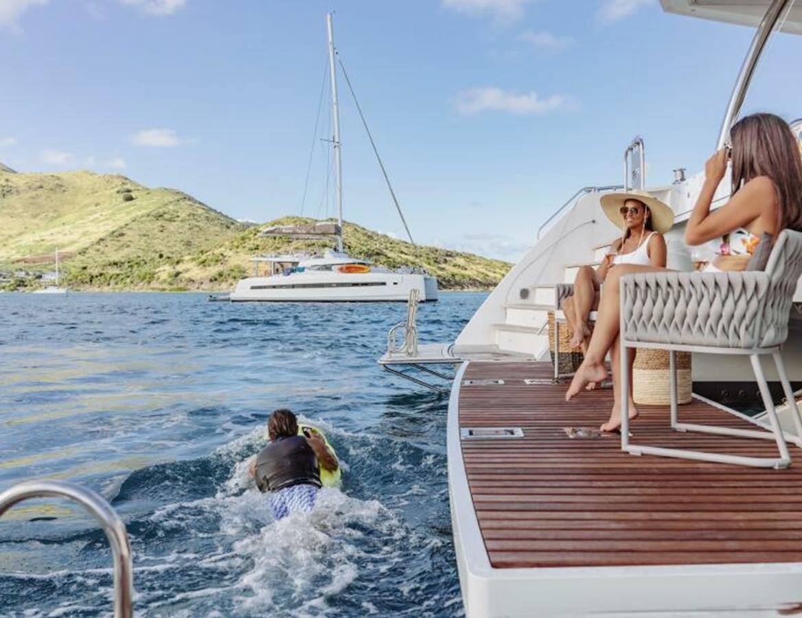 a group of people on a boat aboard 2022 FOUNTAINE PAJOT POWER 67 Yacht for Sale