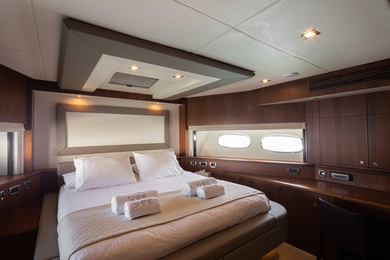 a bed in a room aboard SHINE R Yacht for Sale