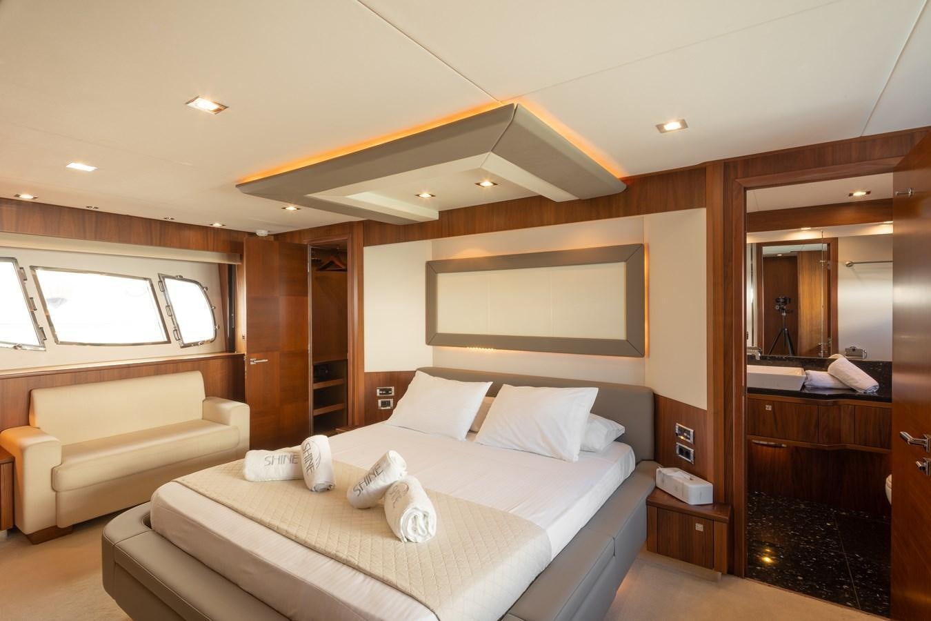 a hotel room with a bed and a tv aboard SHINE R Yacht for Sale