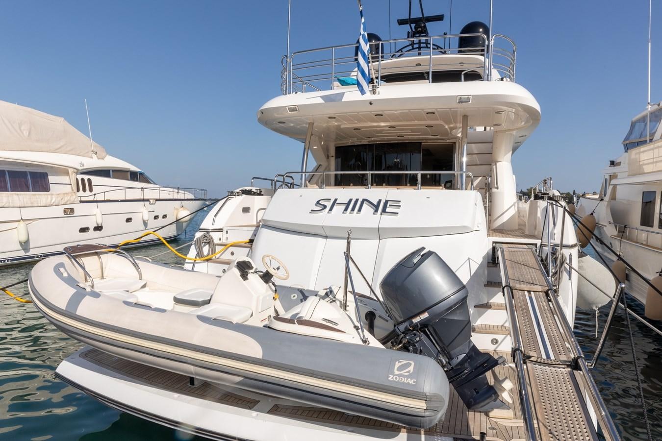 a boat docked at a pier aboard SHINE R Yacht for Sale