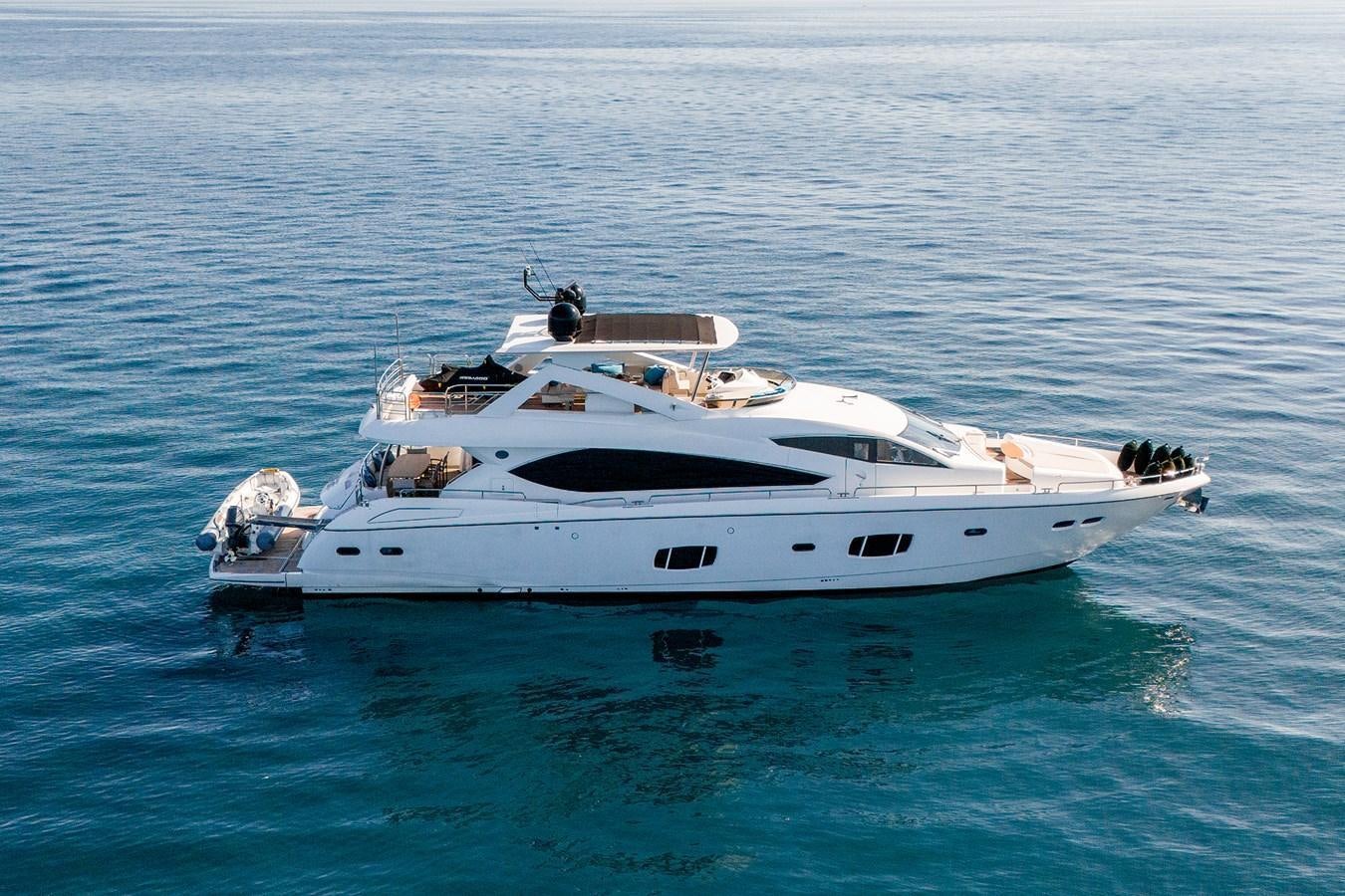 a white yacht in the water aboard SHINE R Yacht for Sale