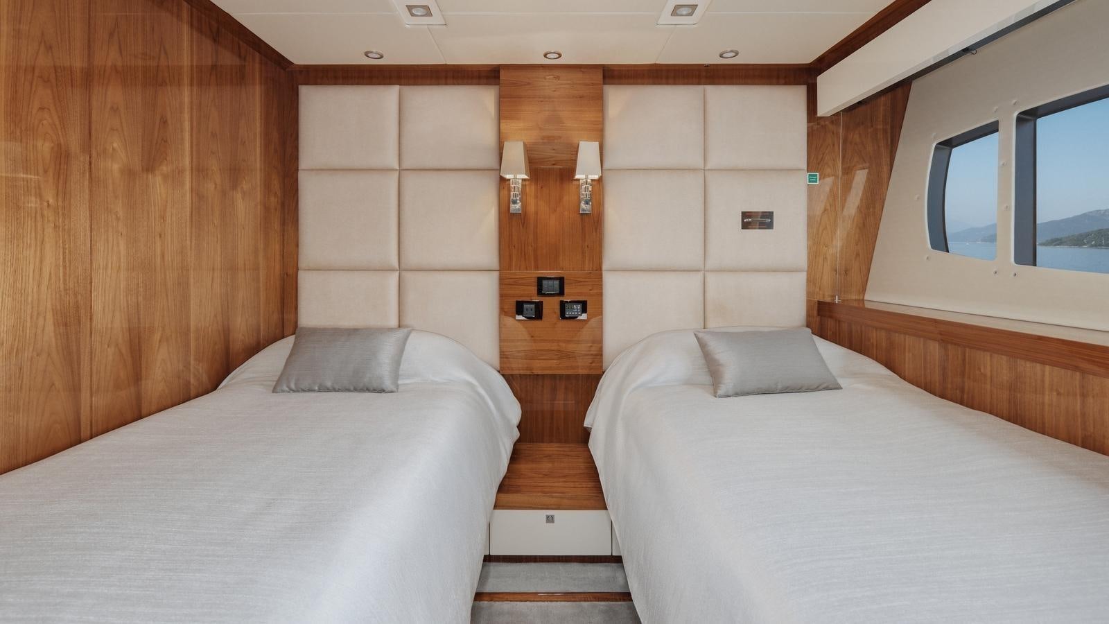 a room with two beds aboard WICKED PLAY Yacht for Sale
