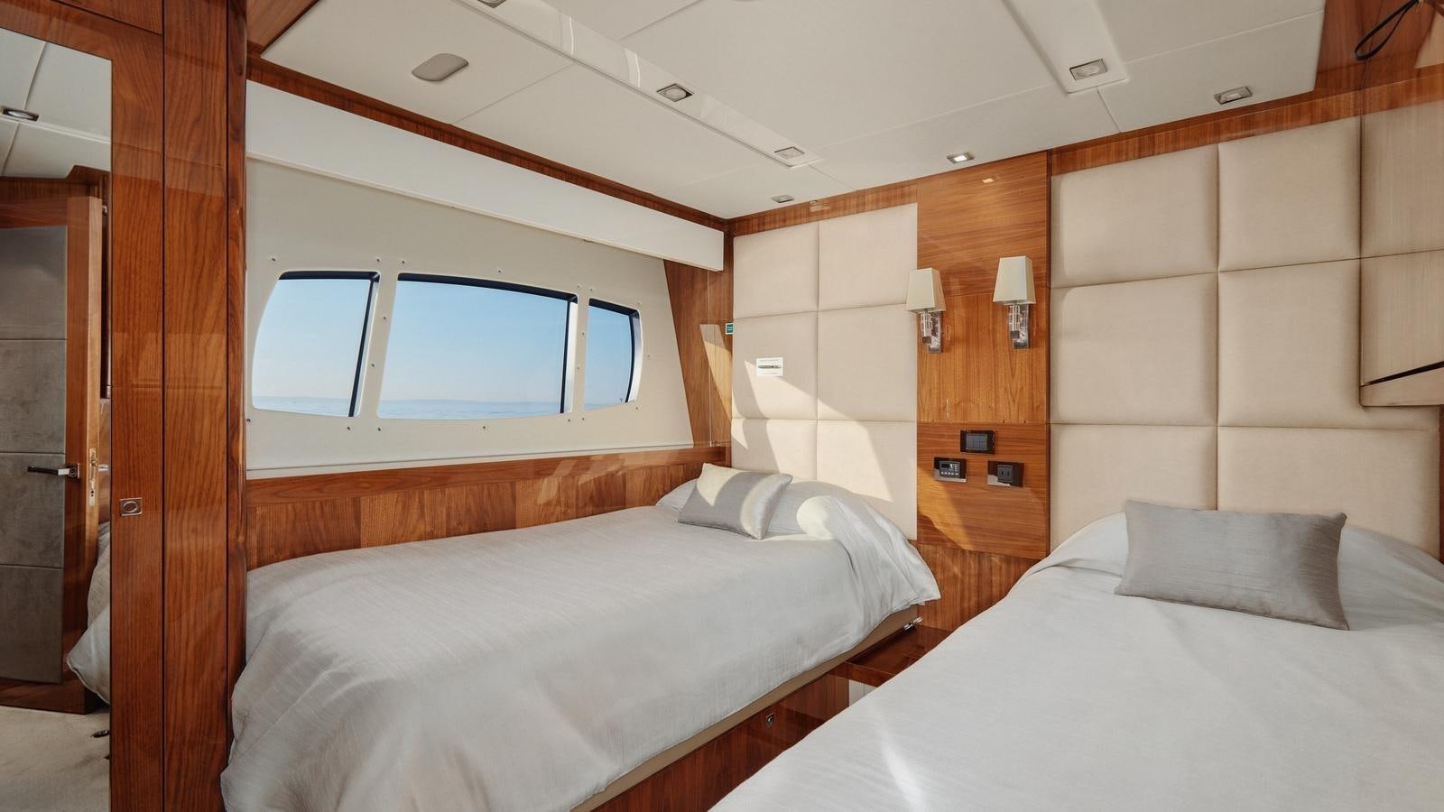 a room with two beds aboard WICKED PLAY Yacht for Sale