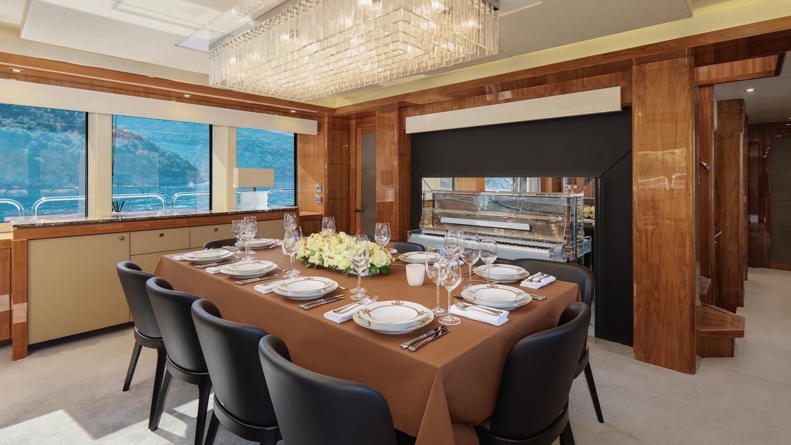 a dining table in a restaurant aboard WICKED PLAY Yacht for Sale
