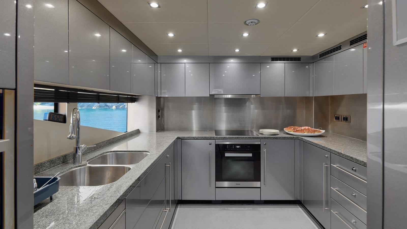 a kitchen with a sink and stove aboard WICKED PLAY Yacht for Sale