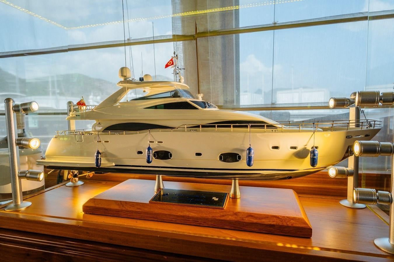 a model of a boat on a table aboard BLEU BLANC Yacht for Sale