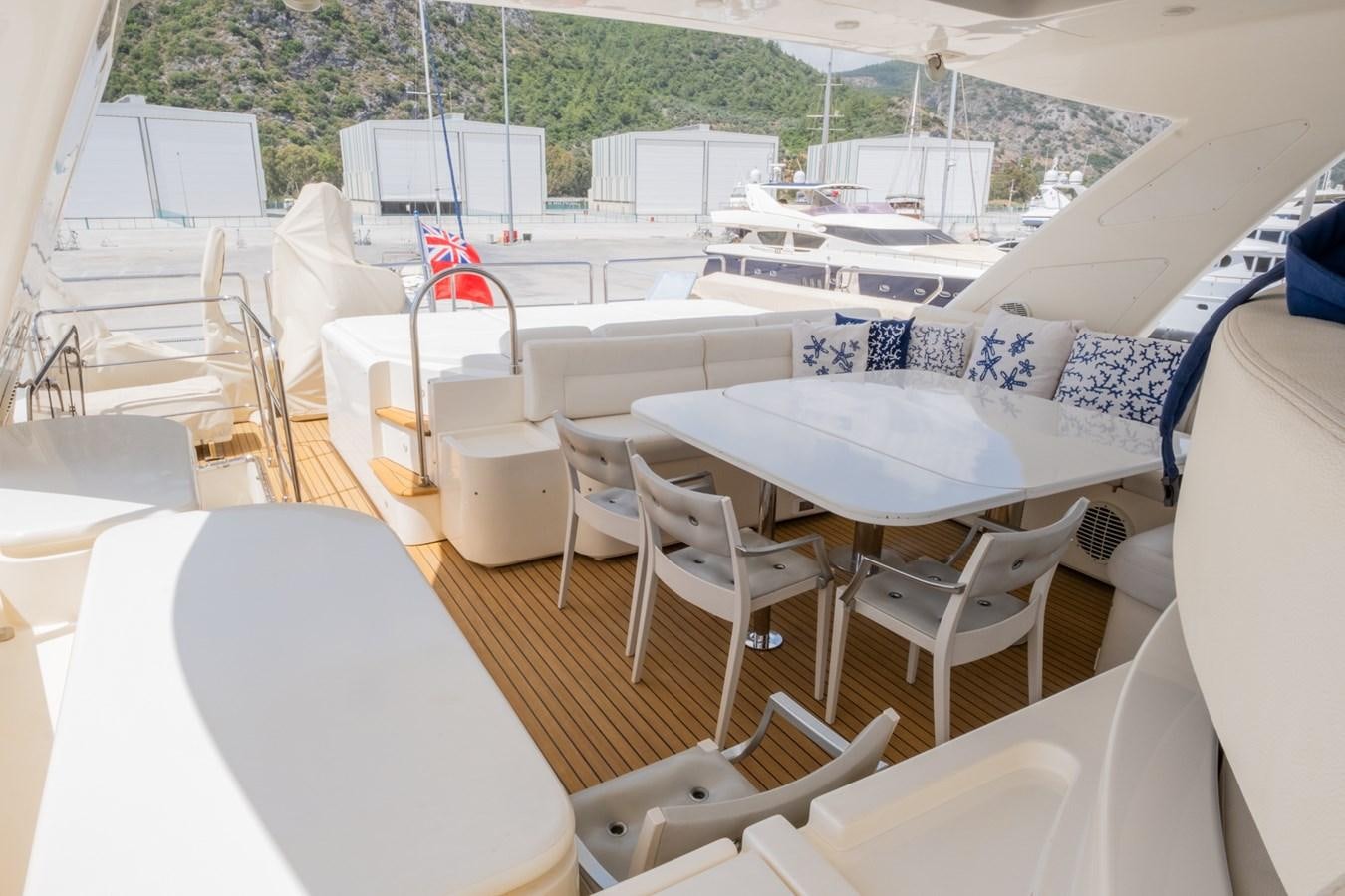 a boat with chairs and tables aboard BLEU BLANC Yacht for Sale