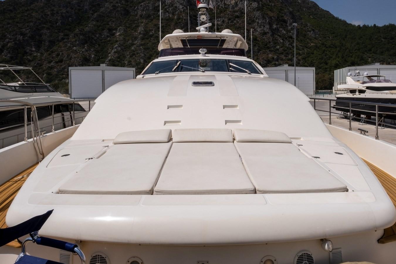 a white yacht in a harbor aboard BLEU BLANC Yacht for Sale