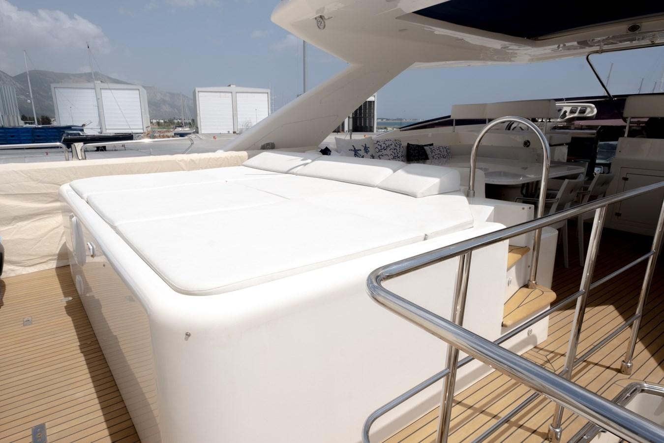 a white lounge chair on a deck aboard BLEU BLANC Yacht for Sale