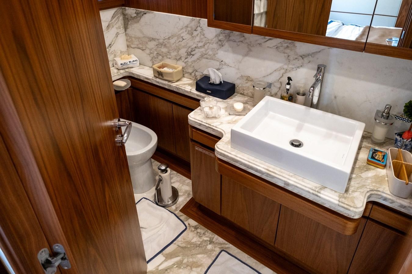 a bathroom with a sink and toilet aboard BLEU BLANC Yacht for Sale