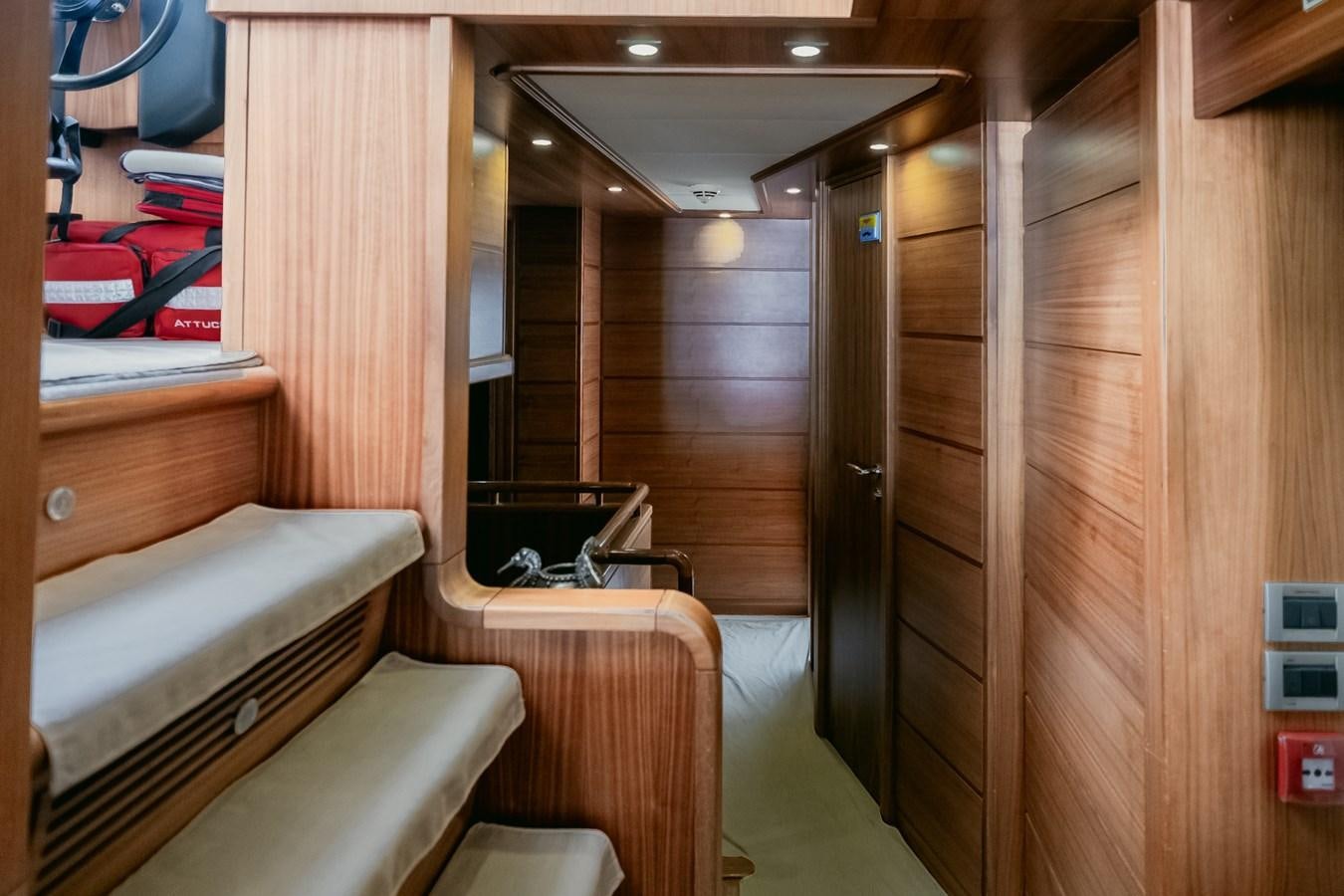 a room with wooden cabinets aboard BLEU BLANC Yacht for Sale