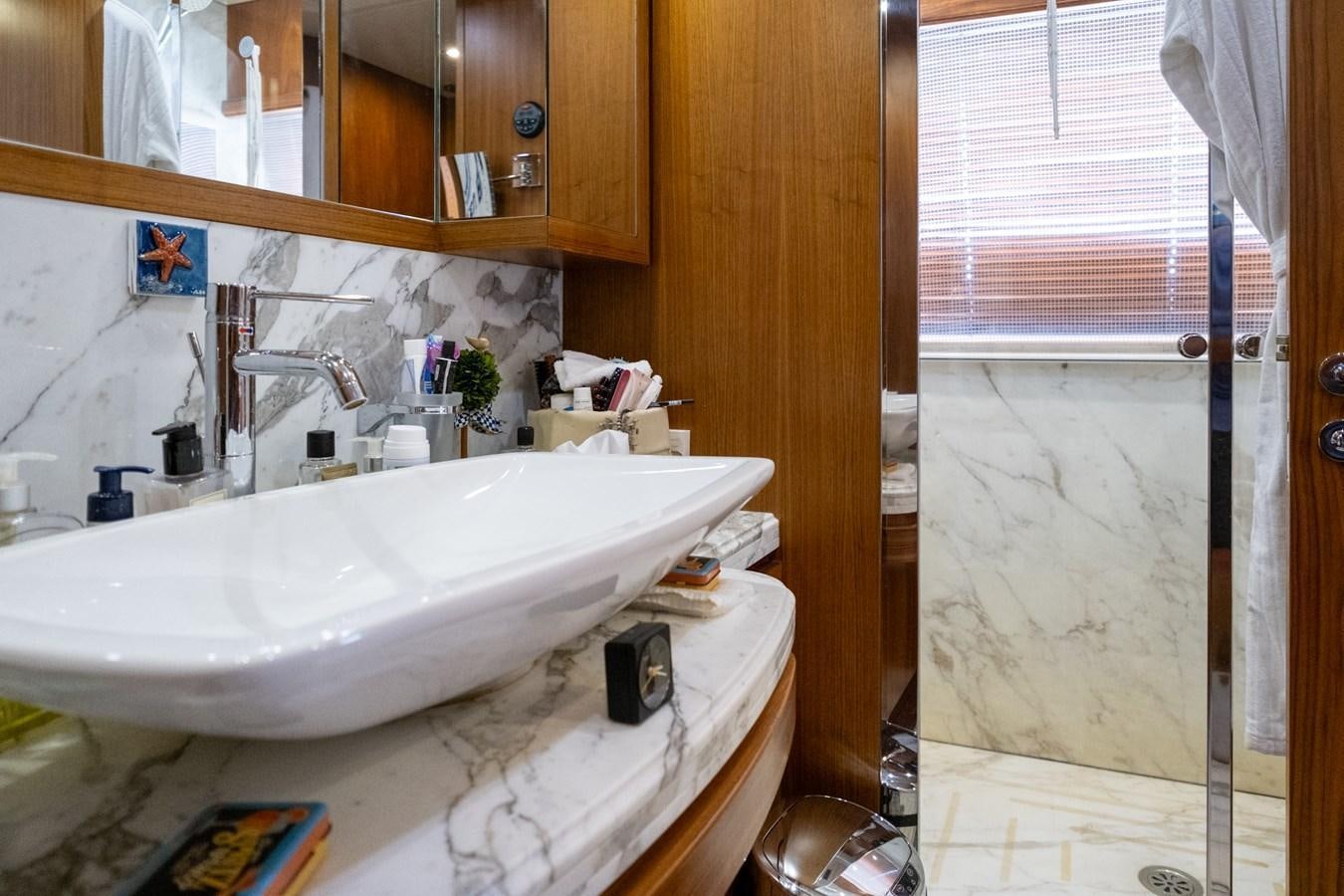 a bathroom with a sink and a toilet aboard BLEU BLANC Yacht for Sale