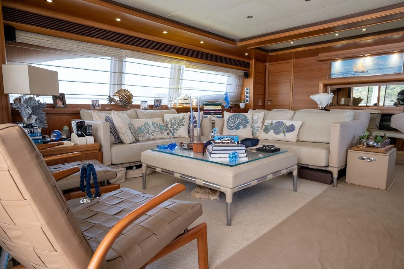 a living room with a couch and a table aboard BLEU BLANC Yacht for Sale