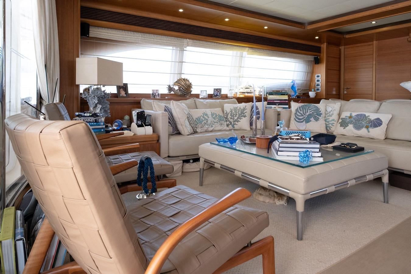 a living room with a couch and a table aboard BLEU BLANC Yacht for Sale