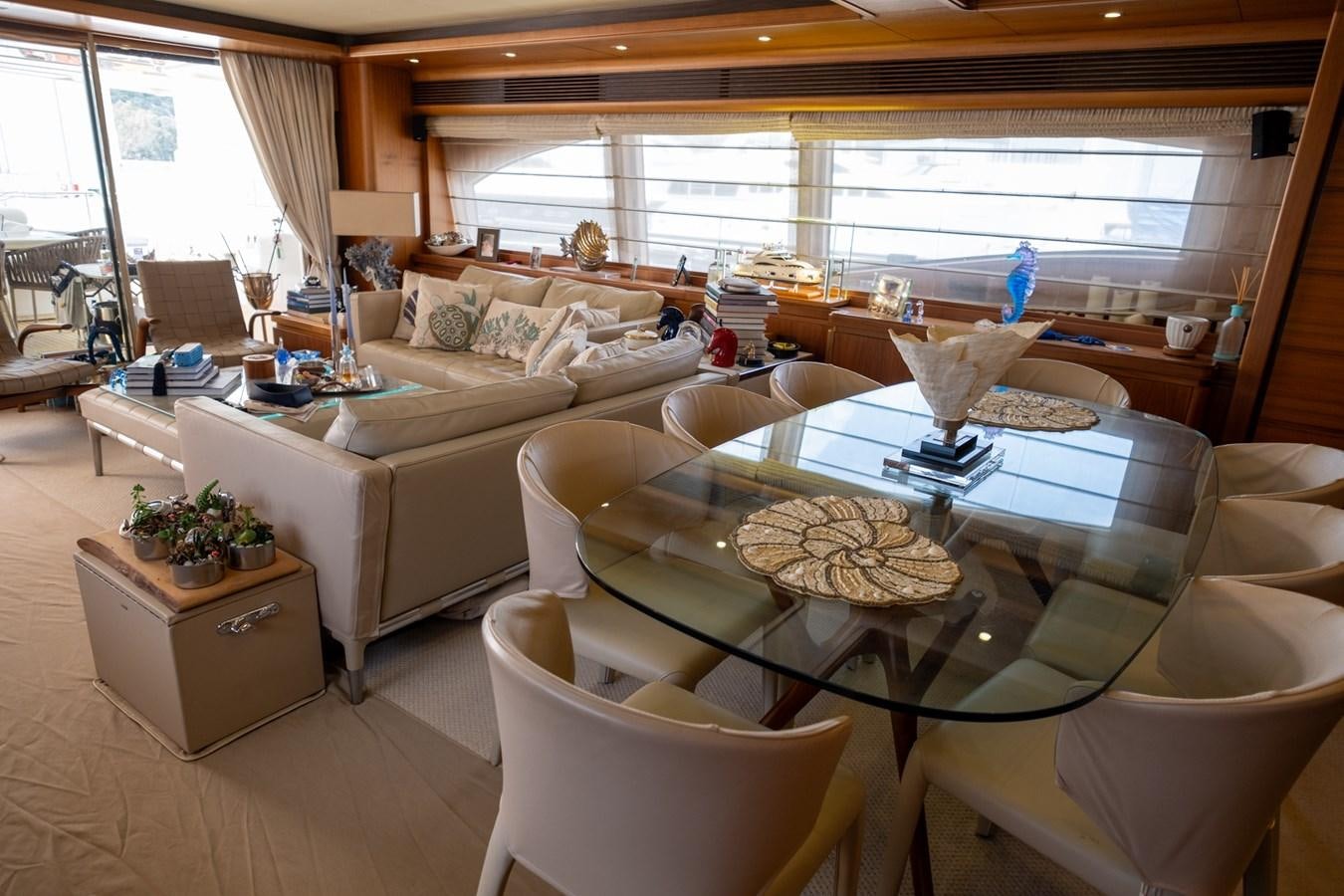 a living room with a couch and a coffee table aboard BLEU BLANC Yacht for Sale