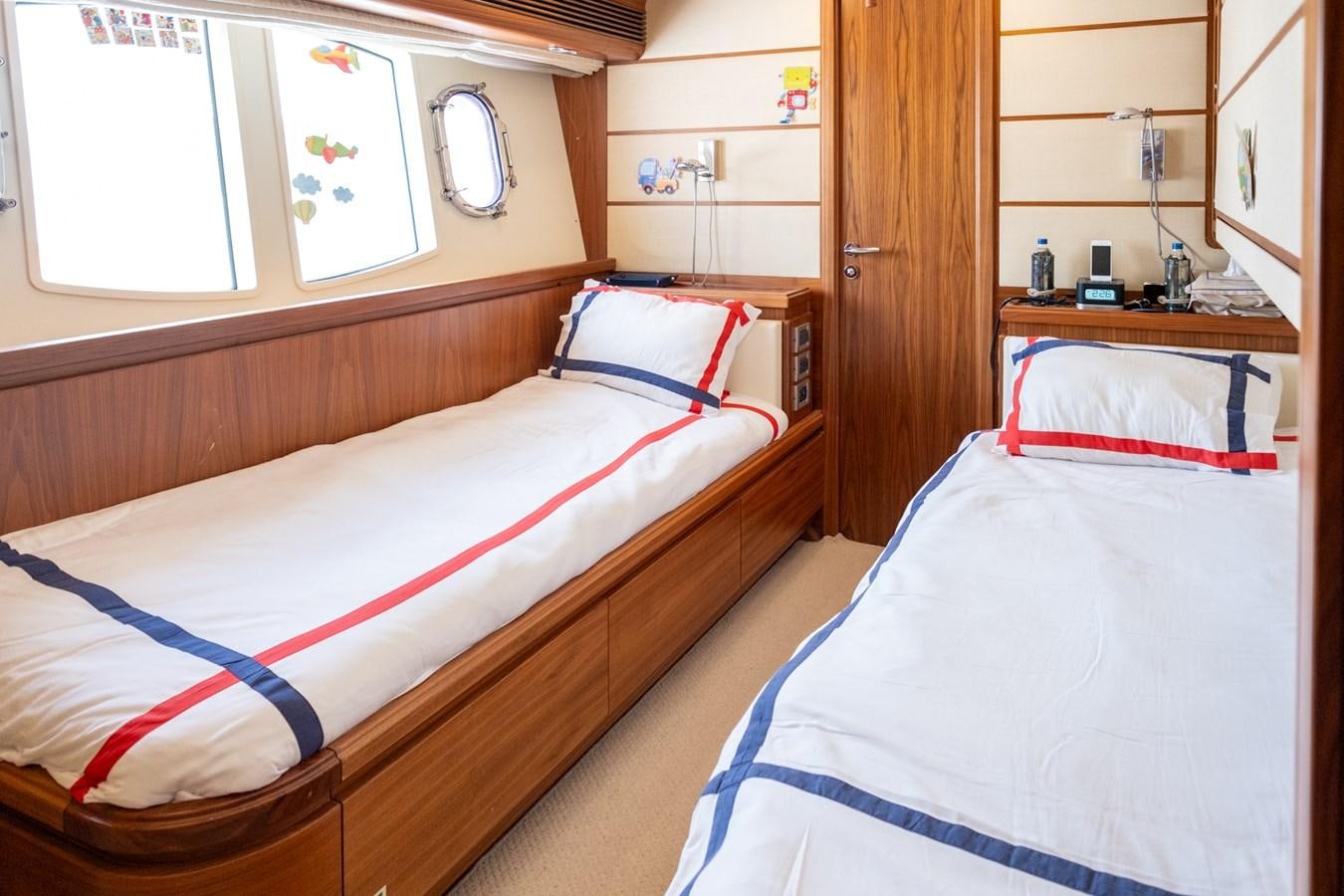 a couple of beds in a room aboard BLEU BLANC Yacht for Sale