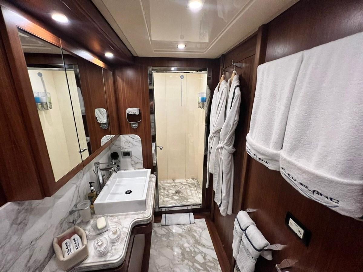 a bathroom with a sink and a mirror aboard BLEU BLANC Yacht for Sale