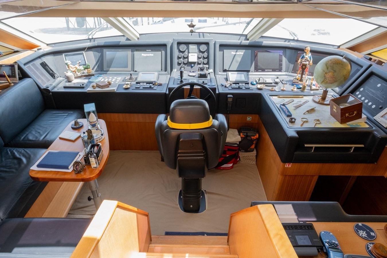 a room with a desk and chairs aboard BLEU BLANC Yacht for Sale