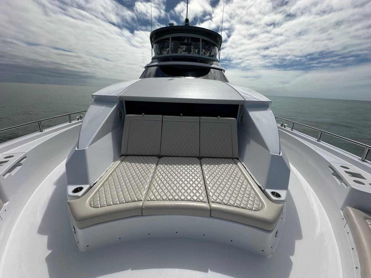 a white boat on a body of water aboard WATER RODEO Yacht for Sale