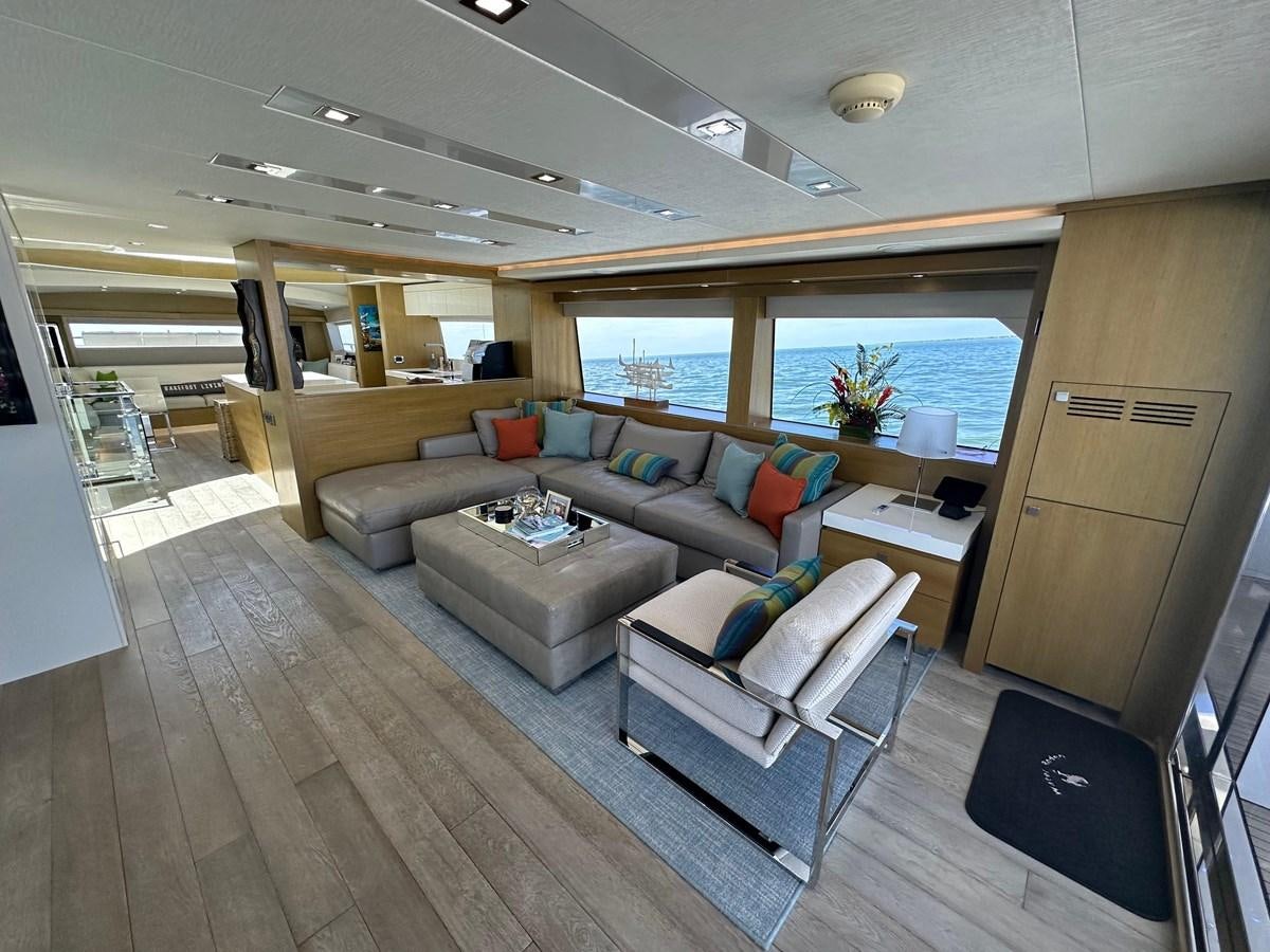 a living room with a large window aboard WATER RODEO Yacht for Sale