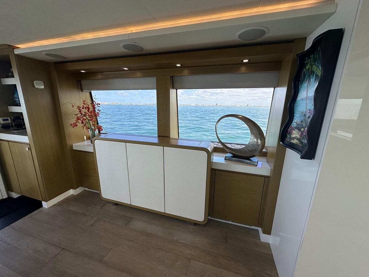 a kitchen with a sink and a large window aboard WATER RODEO Yacht for Sale